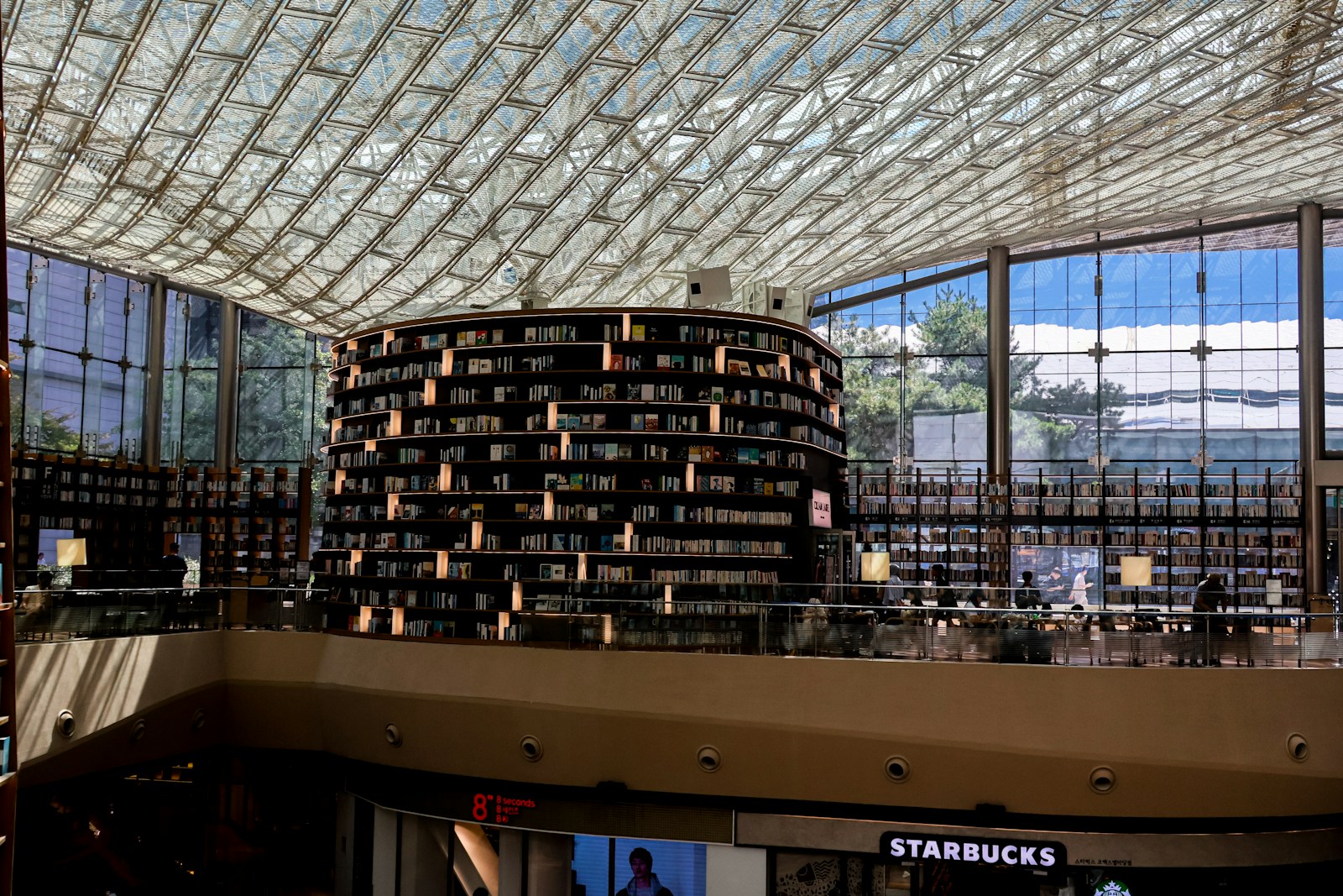 A Large Circular Bookshelf In A Modern Library Wit Jigsaw Puzzle Free Online Jigsaw Puzzle