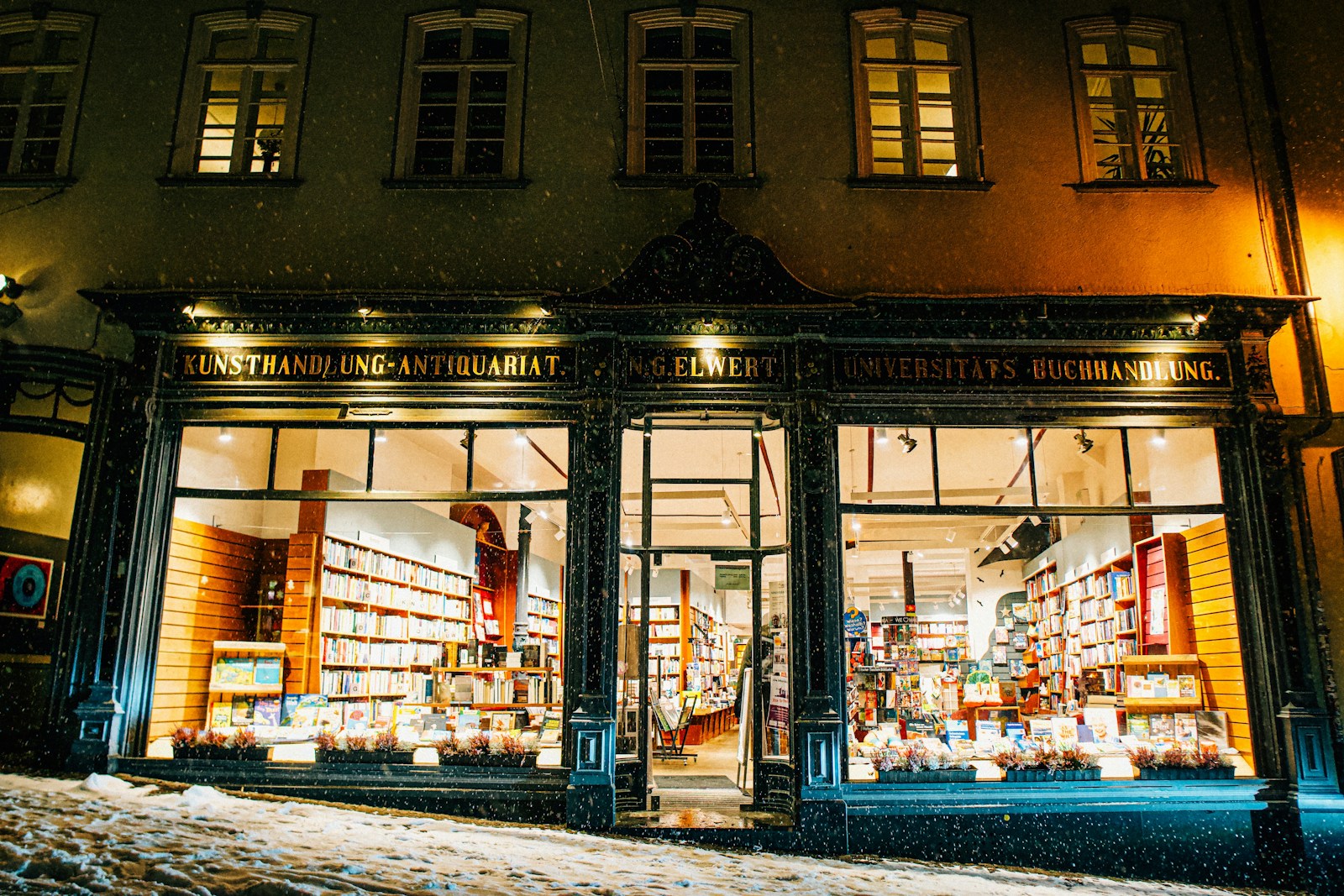 A Store Front At Night With Snow On The Ground Jigsaw Puzzle Free Online Jigsaw Puzzle