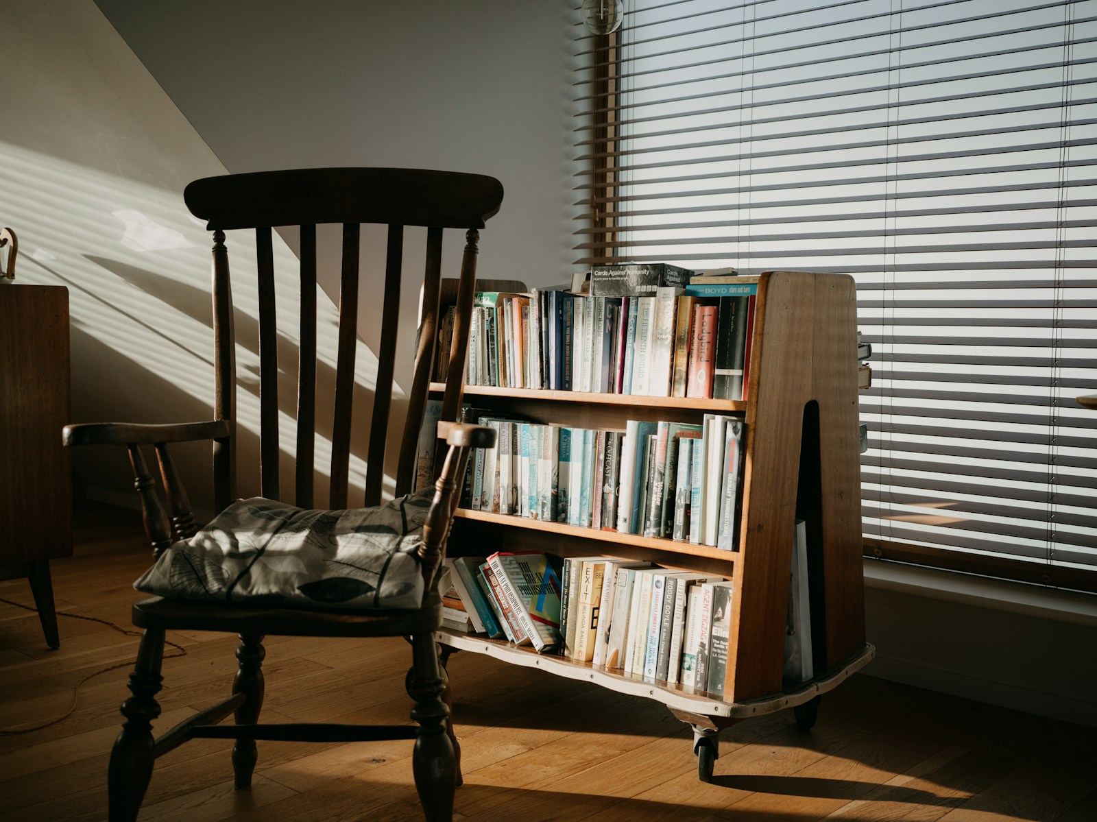 Wooden Chair And Bookshelf Filled With Books Jigsaw Puzzle Free Online Jigsaw Puzzle