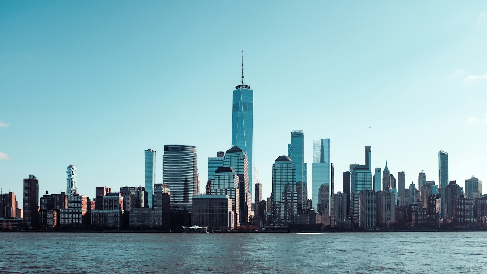 City Skyline Across Body Of Water During Daytime Jigsaw Puzzle Free Online Jigsaw Puzzle