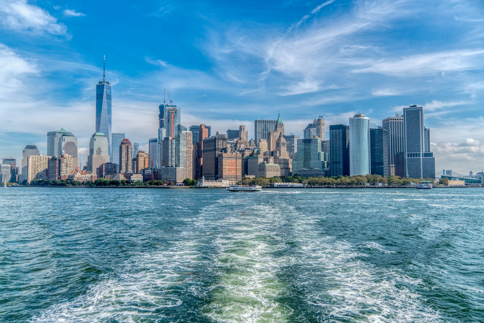City Skyline Across Body Of Water Under Blue And W Jigsaw Puzzle Free Online Jigsaw Puzzle
