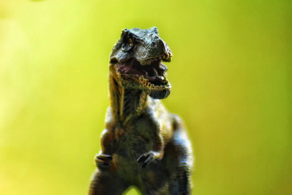 Close Up Of A Toy Dinosaur With A Natural Blurred Jigsaw Puzzle Free Online Jigsaw Puzzle