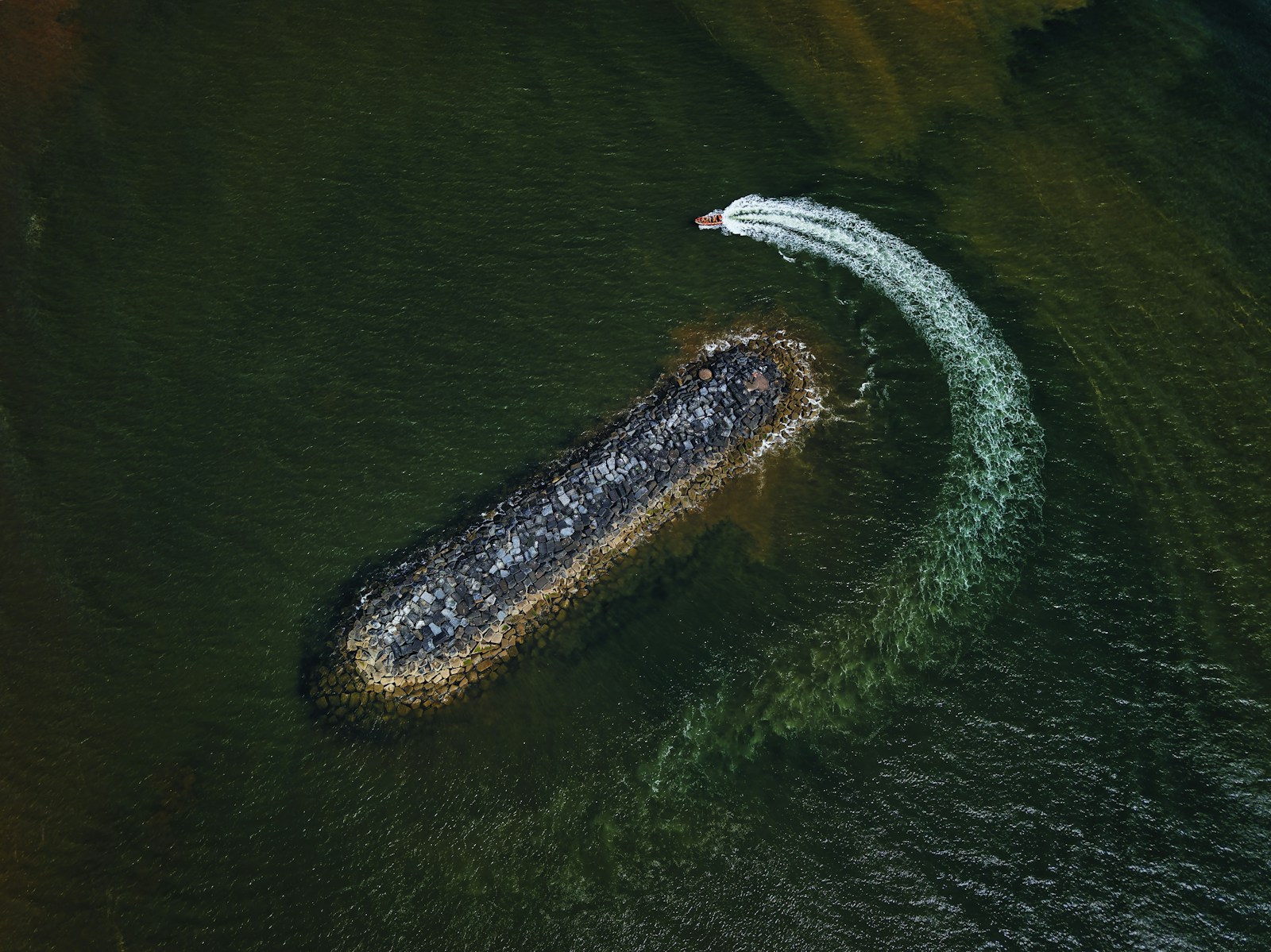 A Boat Turns Near A Rock Jetty Jigsaw Puzzle Free Online Jigsaw Puzzle