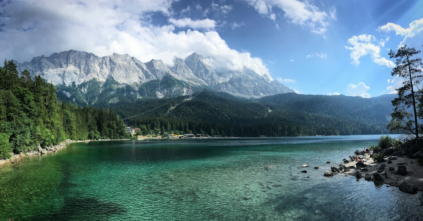 A Lake Surrounded By Trees And Mountains Under A C Jigsaw Puzzle Free Online Jigsaw Puzzle