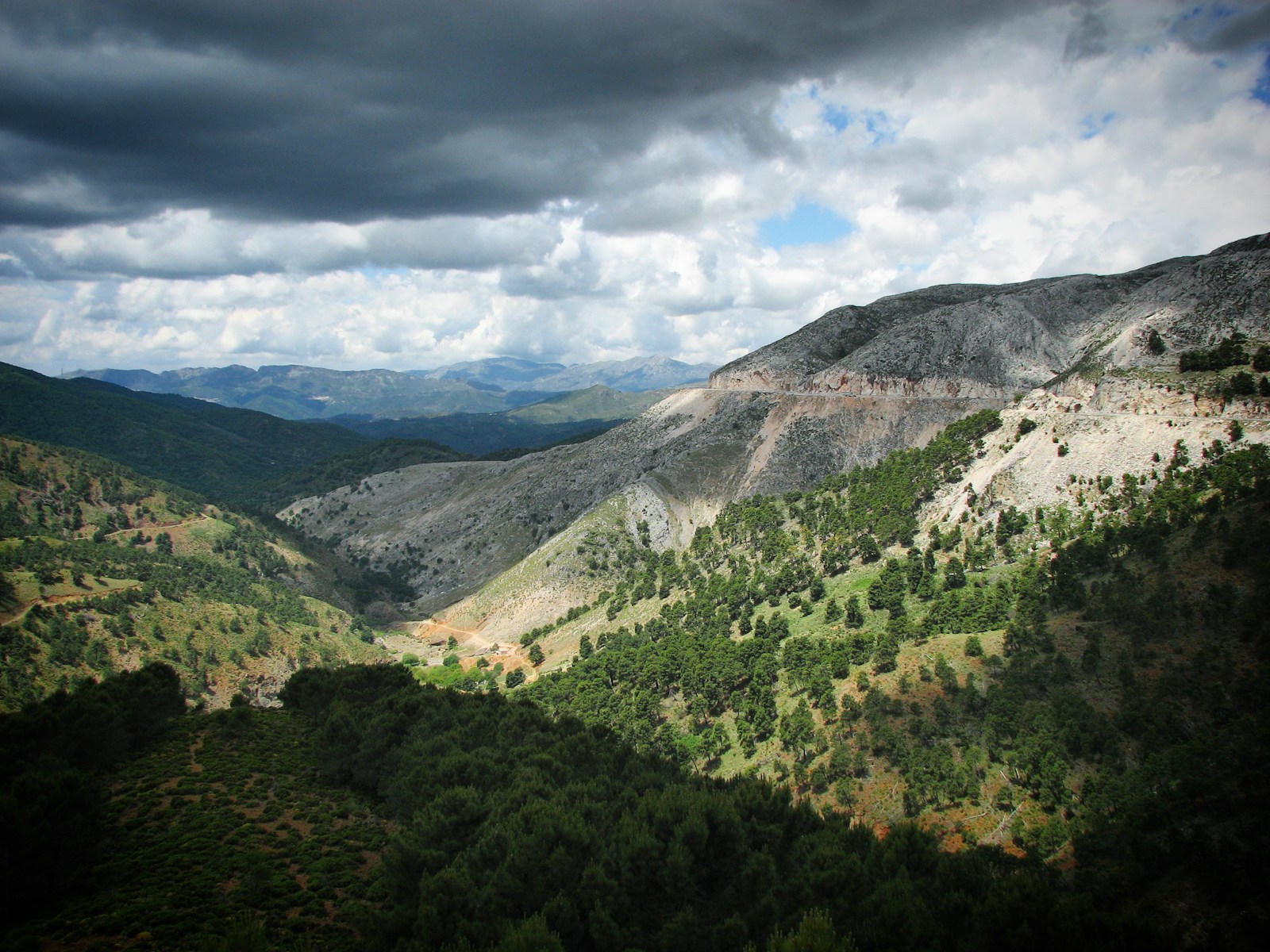 A View Of A Valley And Mountains Under A Cloudy Sk Jigsaw Puzzle Free Online Jigsaw Puzzle