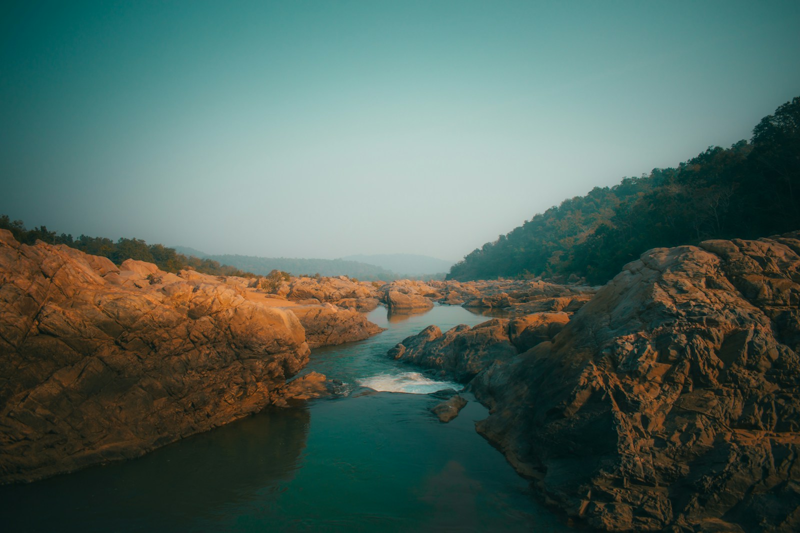 Brown Rocky Mountain Beside River During Daytime Jigsaw Puzzle Free Online Jigsaw Puzzle