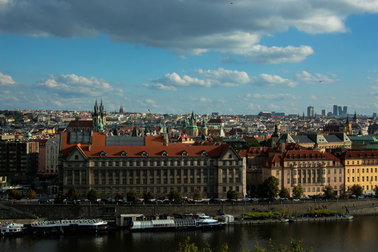 City Skyline With River And Boats Under Cloudy Sky Jigsaw Puzzle Free Online Jigsaw Puzzle